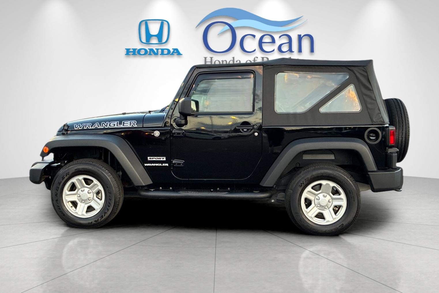 Used 2014 Black Clearcoat Jeep Sport image 6