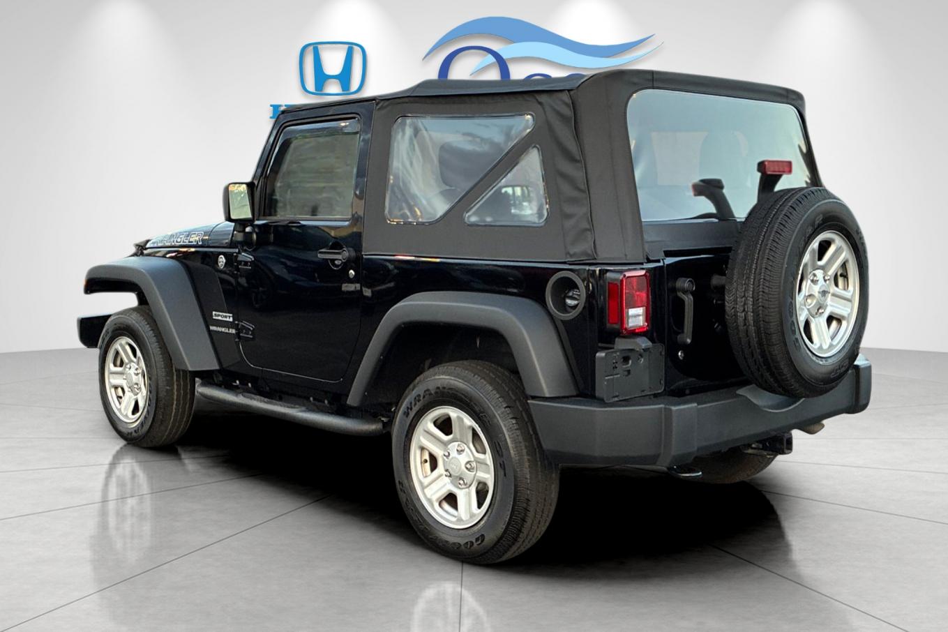 Used 2014 Black Clearcoat Jeep Sport image 5