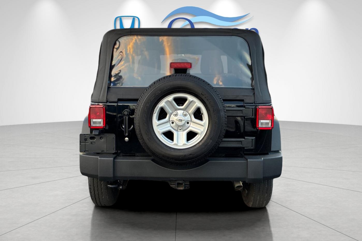 Used 2014 Black Clearcoat Jeep Sport image 4