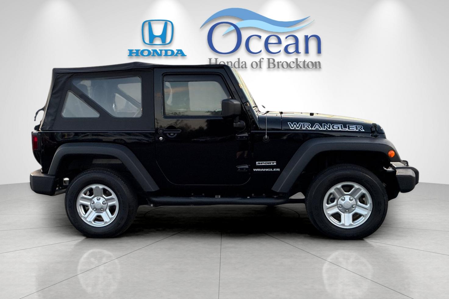 Used 2014 Black Clearcoat Jeep Sport image 2