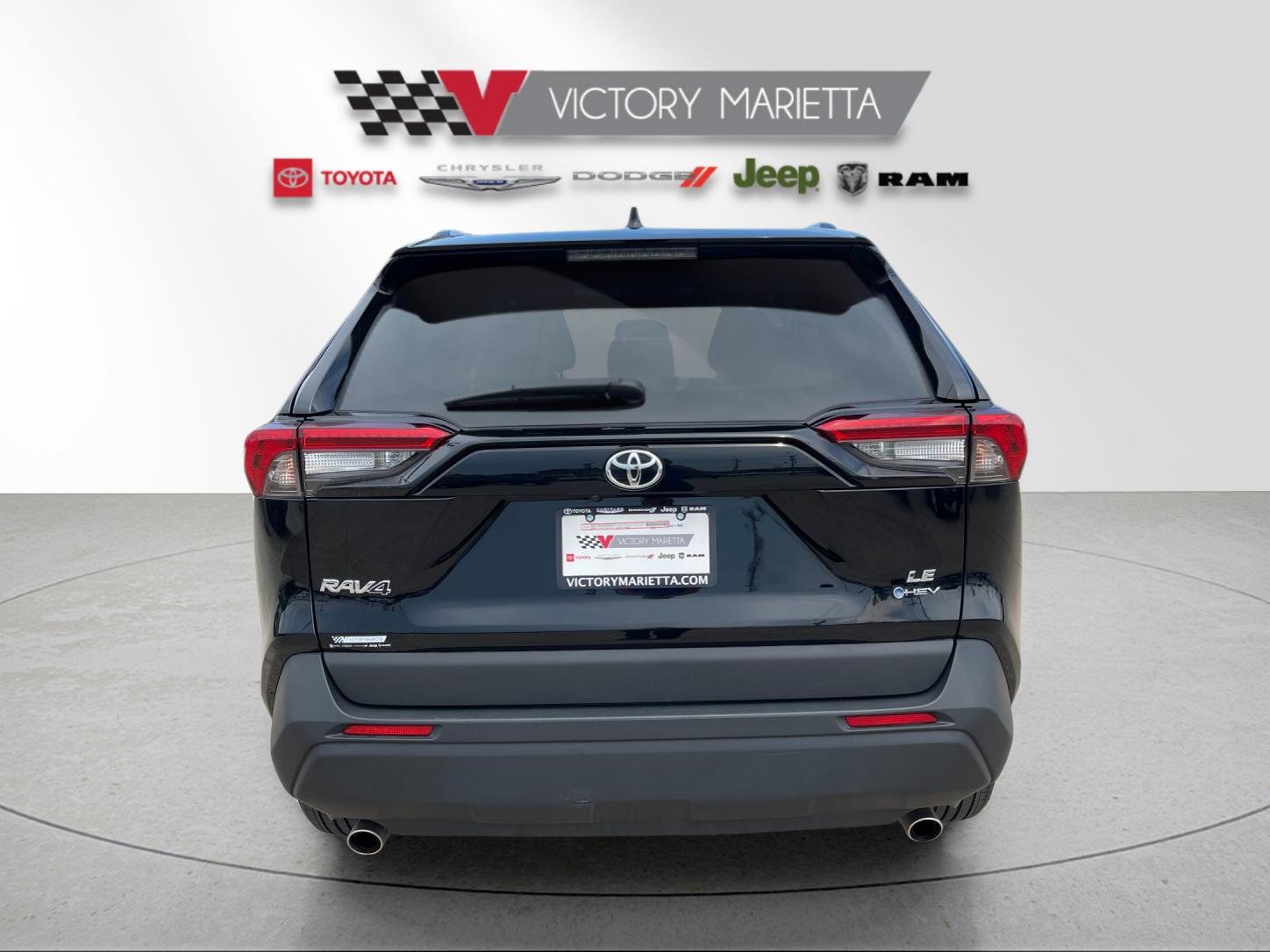 Used 2025 Midnight Black Metallic Toyota LE image 4