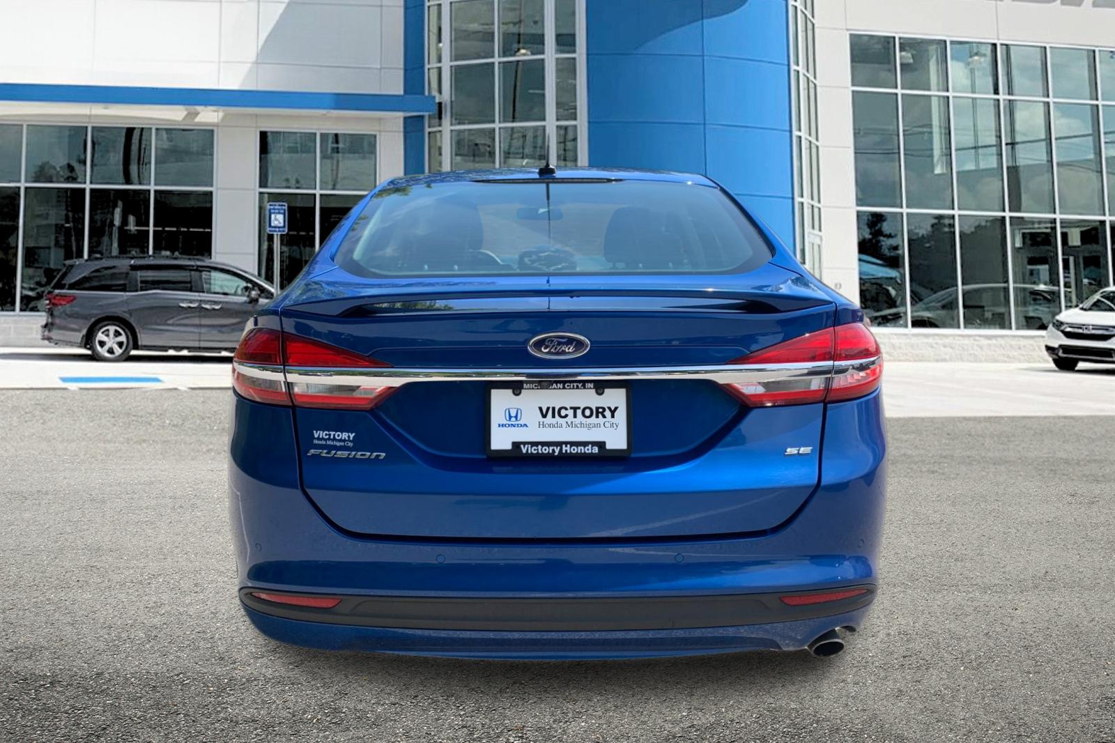Used 2018 Lightning Blue Ford SE image 4