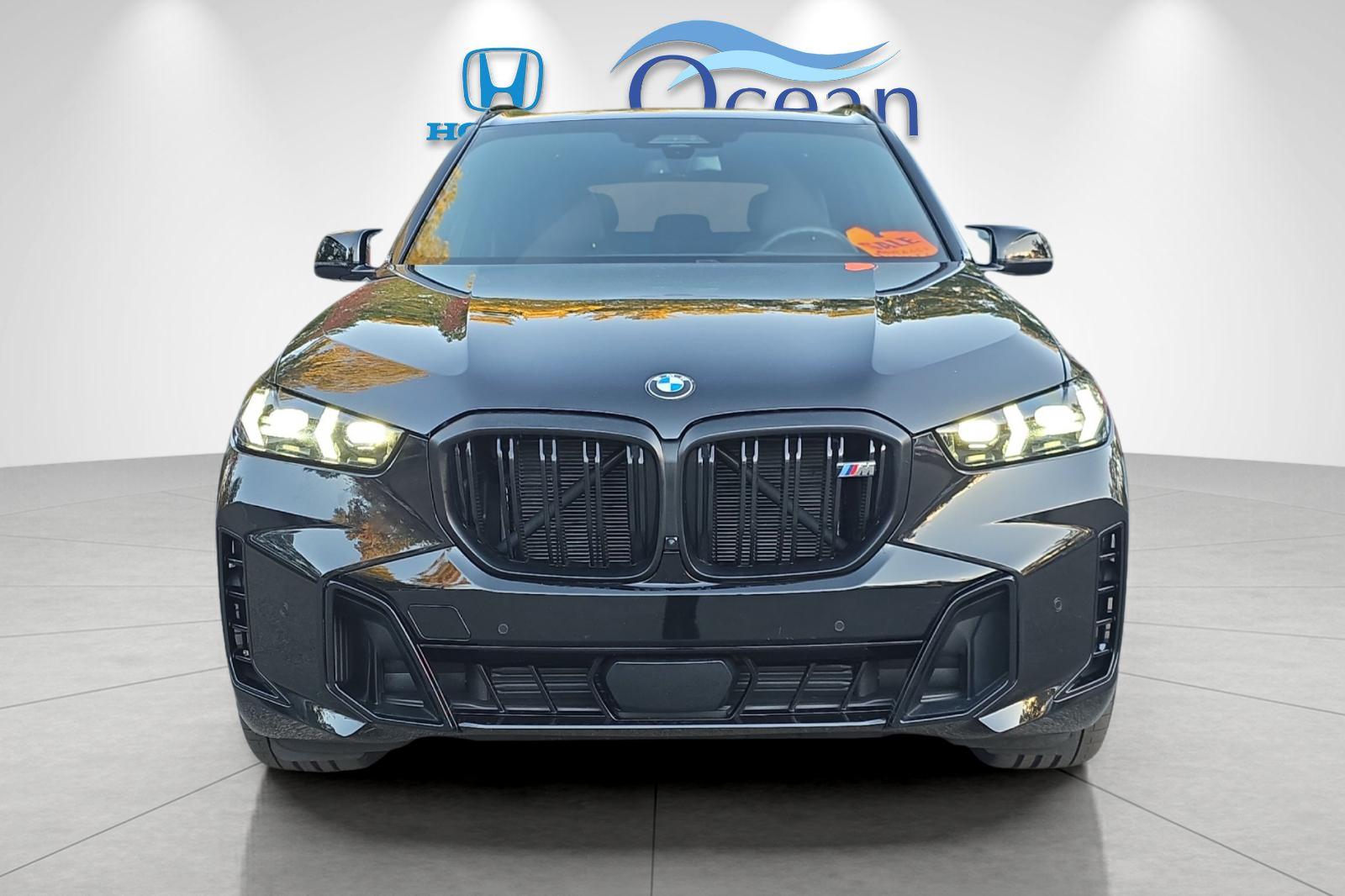Used 2026 Black Sapphire Metallic BMW M60i image 8