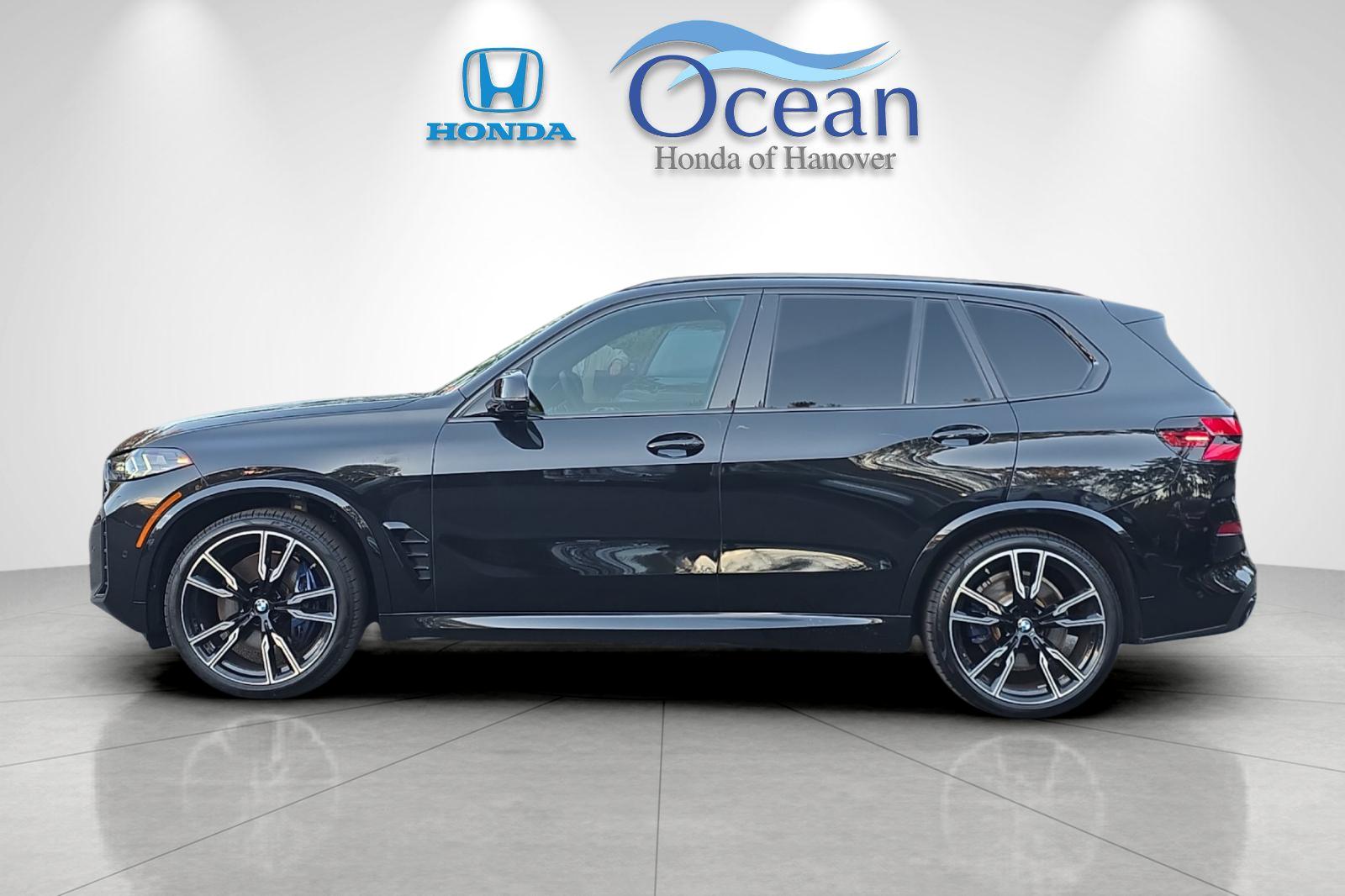 Used 2026 Black Sapphire Metallic BMW M60i image 6