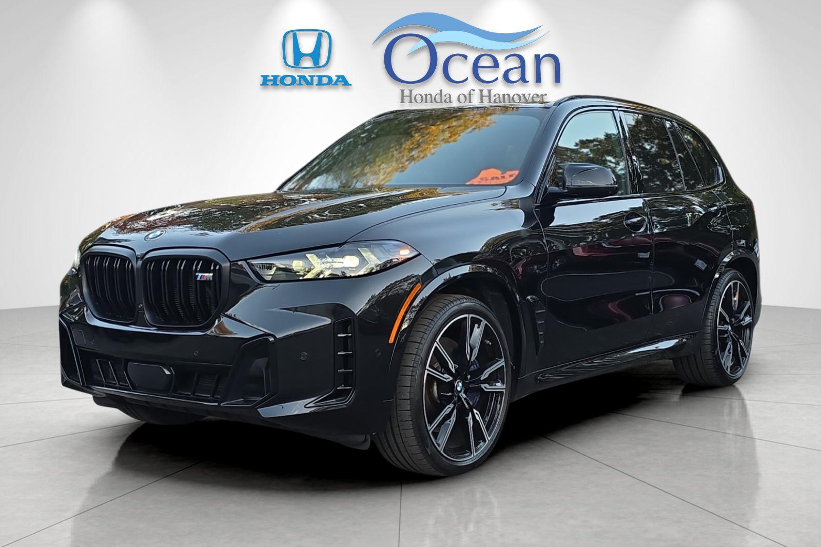 Used 2026 Black Sapphire Metallic BMW M60i image 7