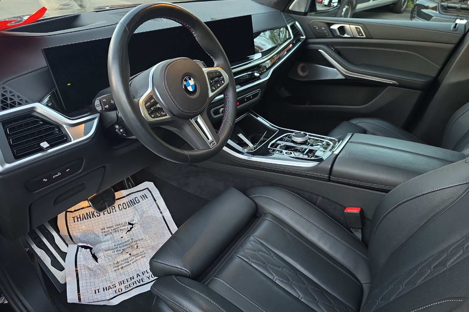 Used 2026 Black Sapphire Metallic BMW M60i image 11