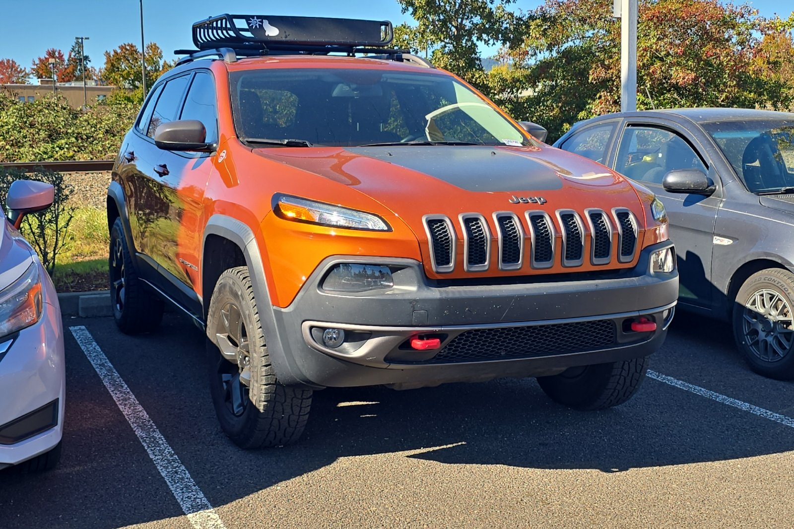 Used 2015 Orange Jeep Trailhawk image 2